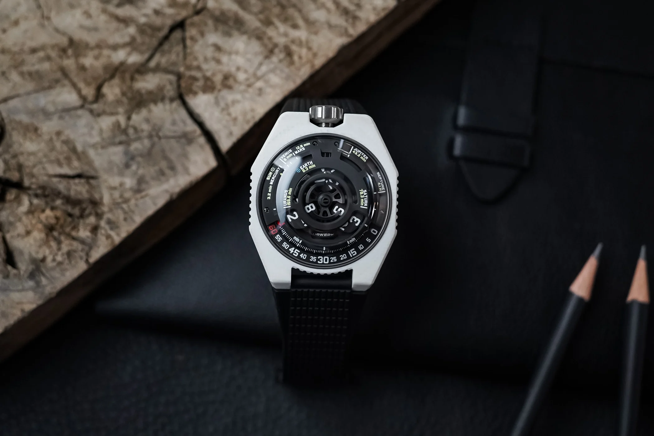 URWERK UR-100V Lightspeed Ceramic showing its white composite case and satellite display